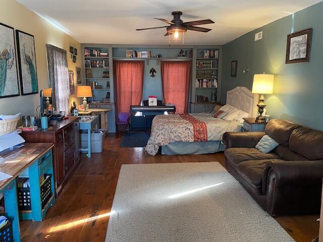 bedroom featuring dark hardwood / wood-style flooring