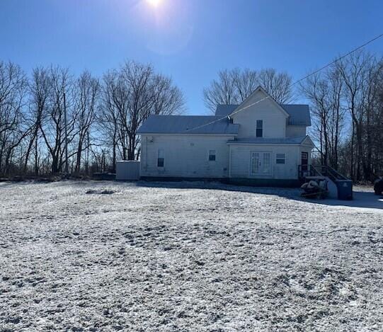 view of snow covered house