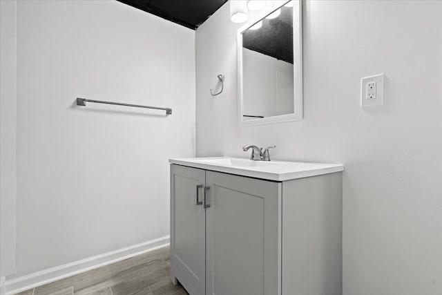 bathroom featuring vanity and hardwood / wood-style flooring