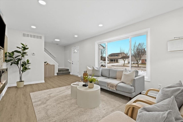 living room with light hardwood / wood-style flooring