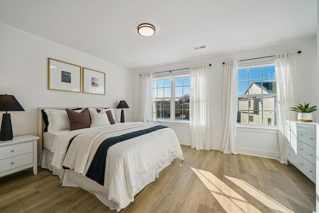 bedroom featuring light hardwood / wood-style floors