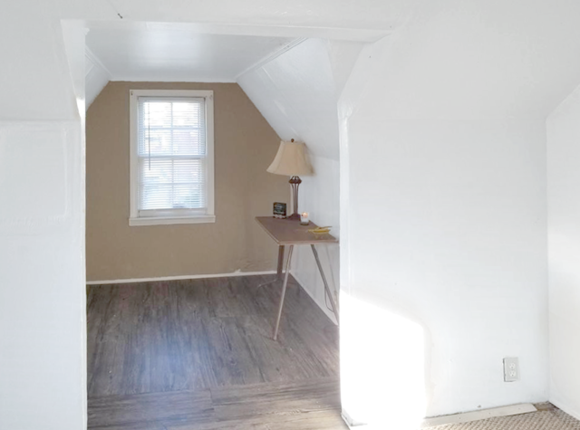 bonus room featuring vaulted ceiling and hardwood / wood-style floors