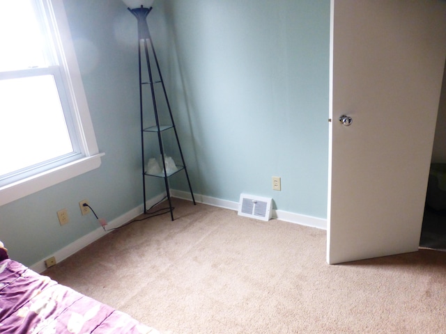 unfurnished bedroom with light carpet