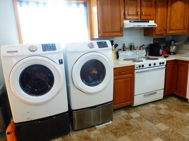 laundry room with separate washer and dryer