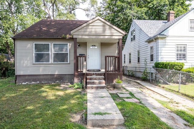 bungalow with a front lawn