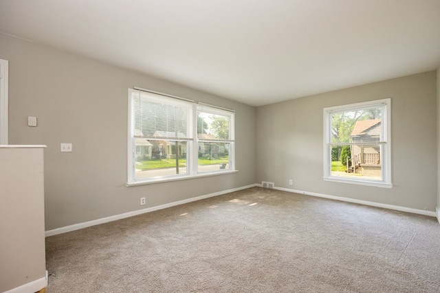 spare room with carpet floors