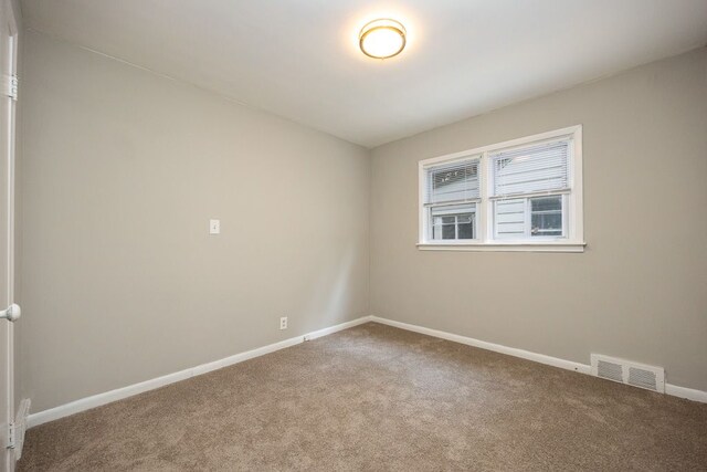 unfurnished room featuring carpet floors