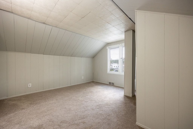 bonus room with carpet and lofted ceiling