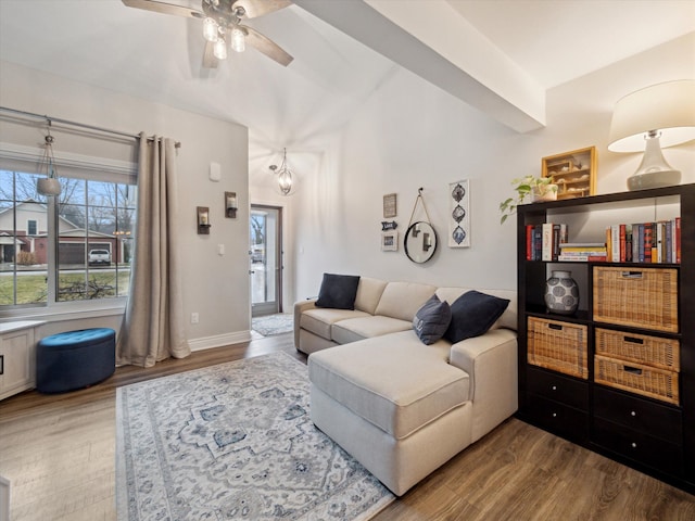 living room with lofted ceiling, hardwood / wood-style flooring, and ceiling fan