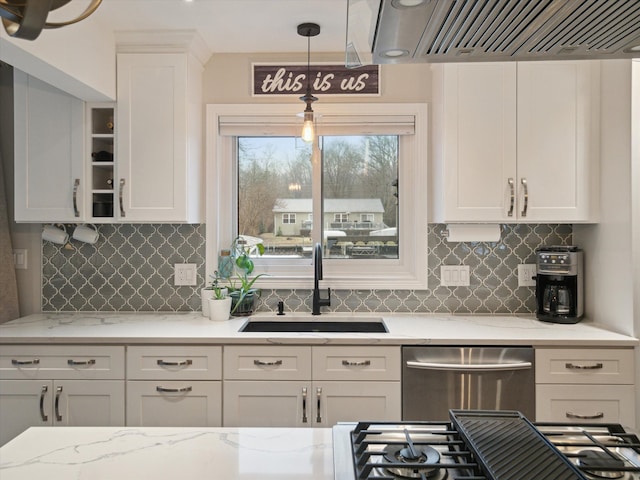 kitchen with sink, ventilation hood, white cabinets, decorative light fixtures, and stainless steel dishwasher