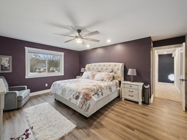 bedroom featuring wood-type flooring and ceiling fan