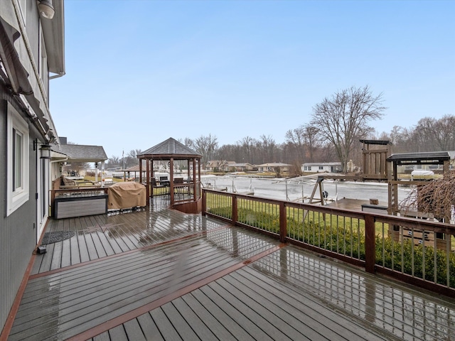 wooden deck featuring a gazebo