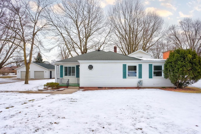 view of front of house featuring an outbuilding and a garage