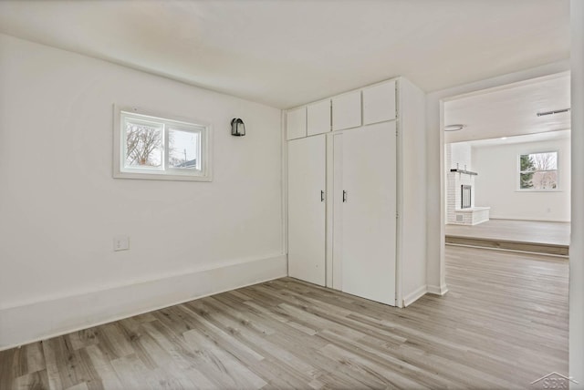 unfurnished bedroom featuring a closet and light hardwood / wood-style flooring