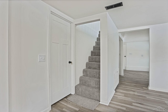 stairway with wood-type flooring