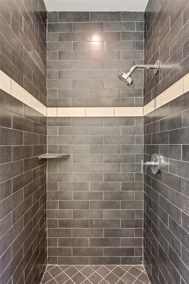 bathroom with tiled shower