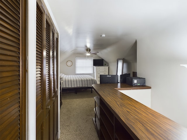 unfurnished bedroom with lofted ceiling and carpet flooring