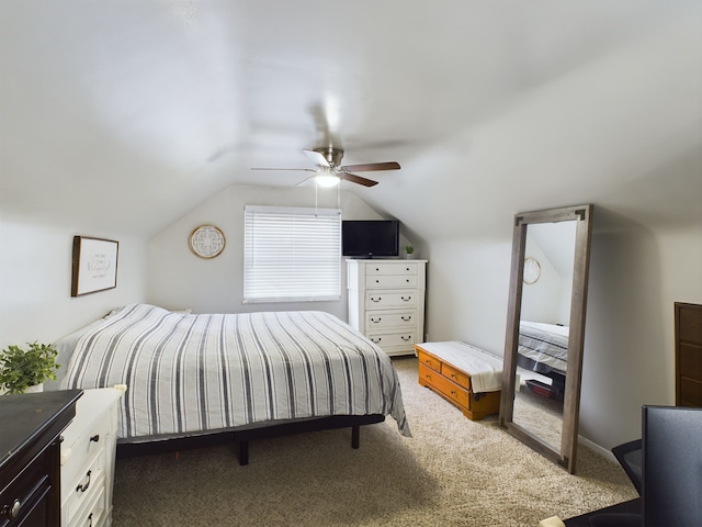 bedroom with a ceiling fan, carpet, and vaulted ceiling