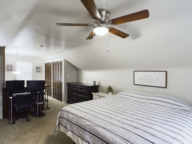 bedroom with lofted ceiling, carpet, and ceiling fan