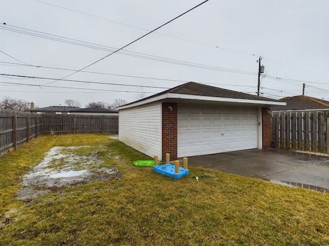 detached garage featuring fence