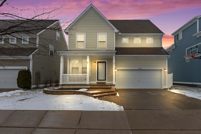 view of front of property with a garage and covered porch