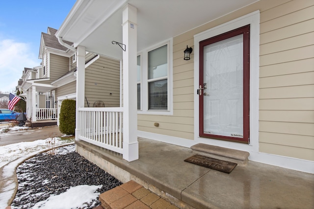 view of snow covered property entrance