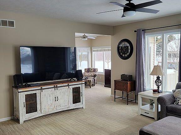 living room with ceiling fan