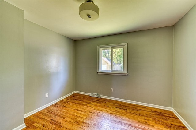 unfurnished room featuring light hardwood / wood-style flooring