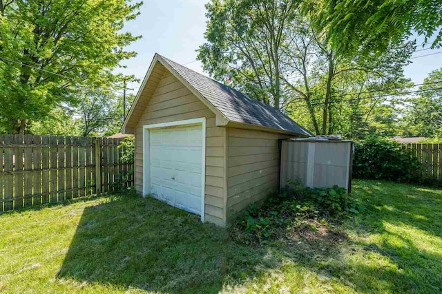 garage featuring a lawn