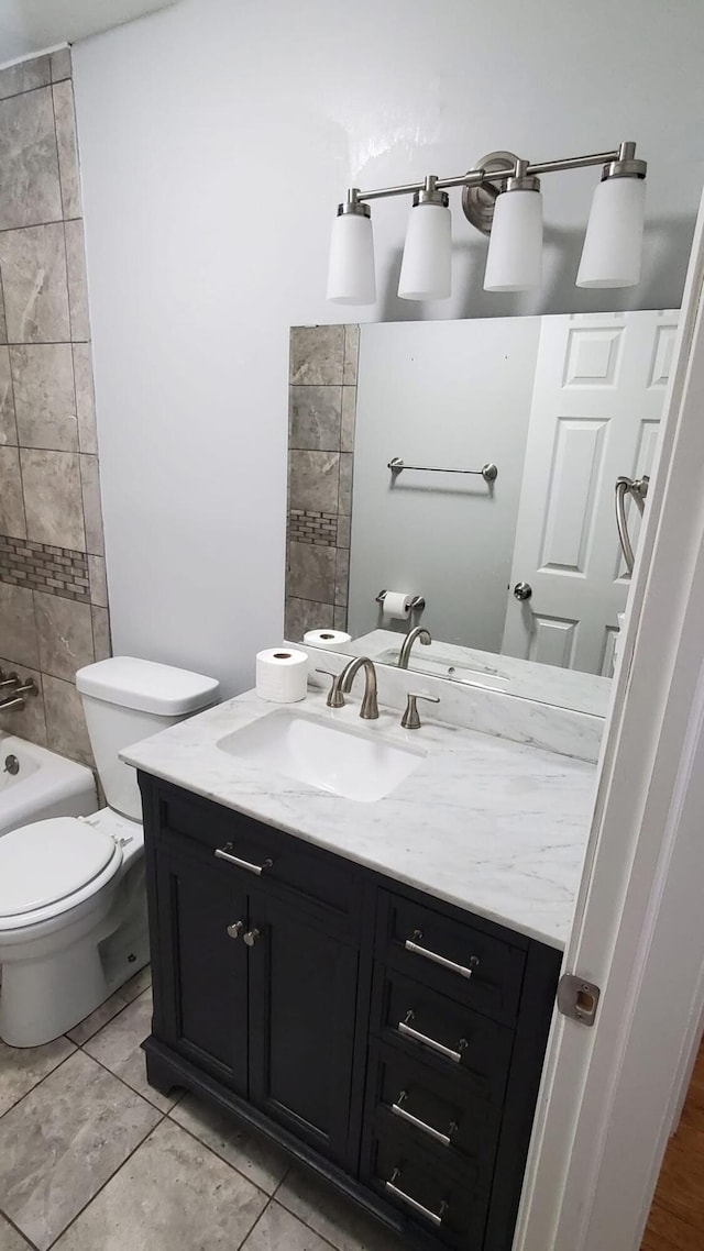 full bathroom featuring shower / bathtub combination, vanity, toilet, and tile patterned flooring