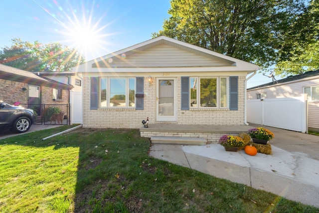 bungalow with a front yard