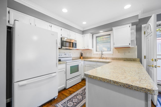 kitchen with white cabinetry, white appliances, ornamental molding, and sink