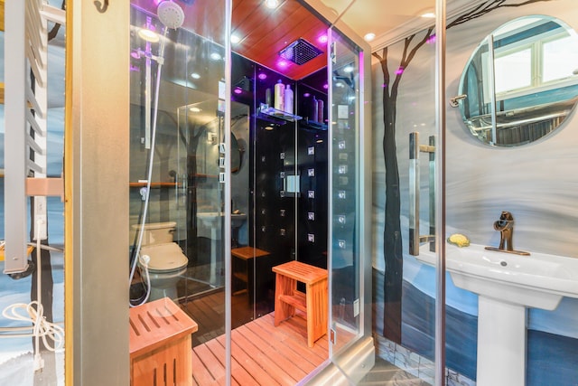 bathroom featuring wood-type flooring and toilet