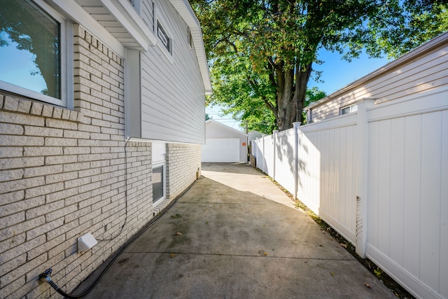 view of property exterior featuring an outbuilding and a garage