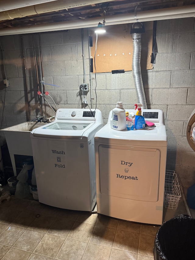 clothes washing area with washer and dryer