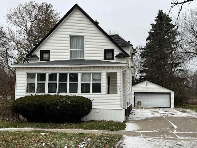 view of front of house featuring a garage and an outdoor structure