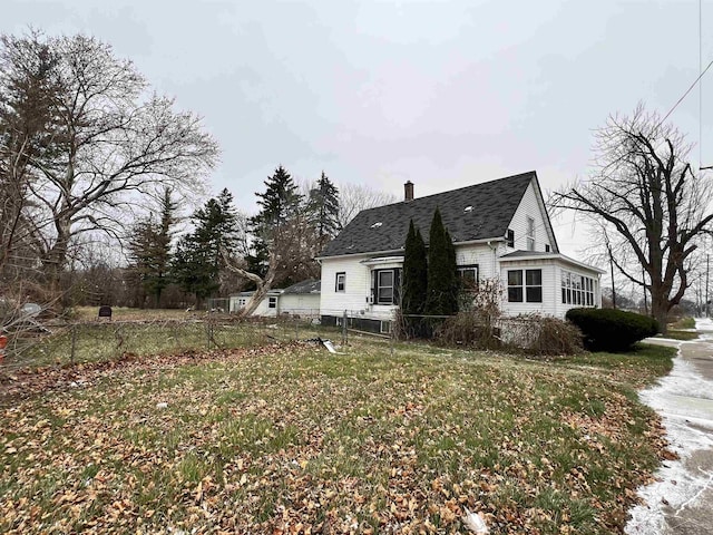 view of property exterior featuring a lawn