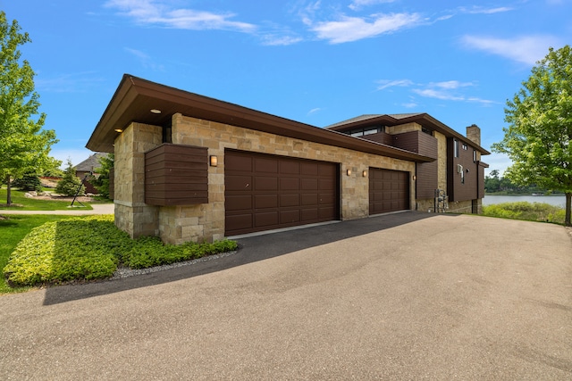 view of side of home with a garage