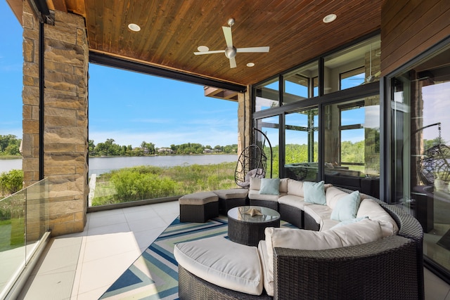 view of patio / terrace featuring an outdoor living space, a water view, and ceiling fan