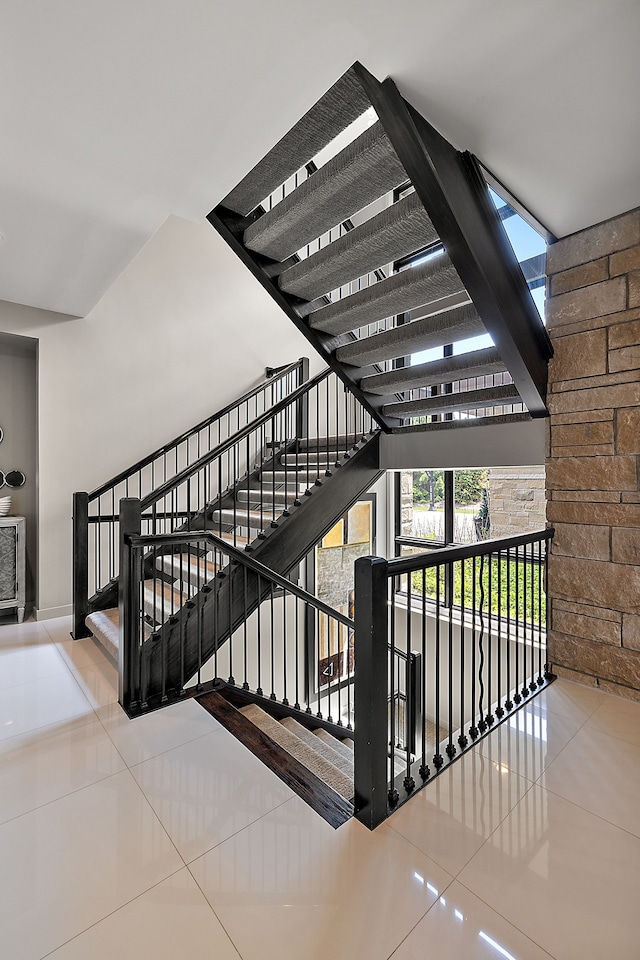 stairs with tile patterned flooring