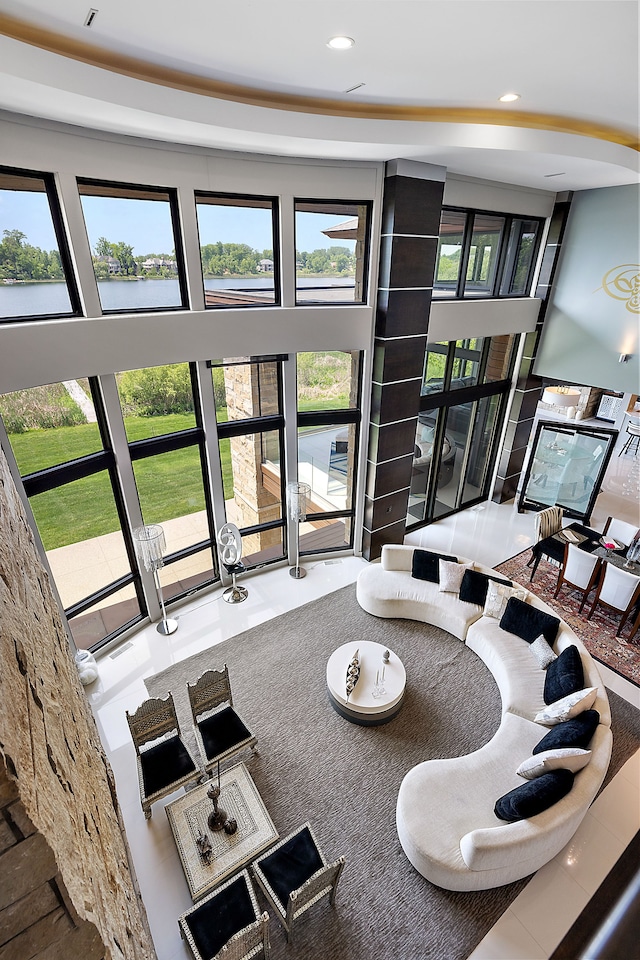 living room featuring a towering ceiling