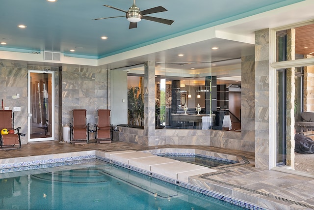 view of swimming pool featuring an indoor hot tub and ceiling fan