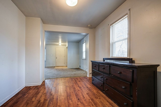 hall with dark hardwood / wood-style floors