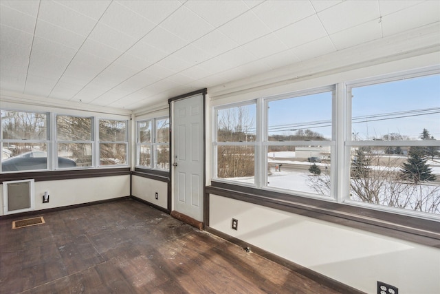 unfurnished sunroom with a wealth of natural light