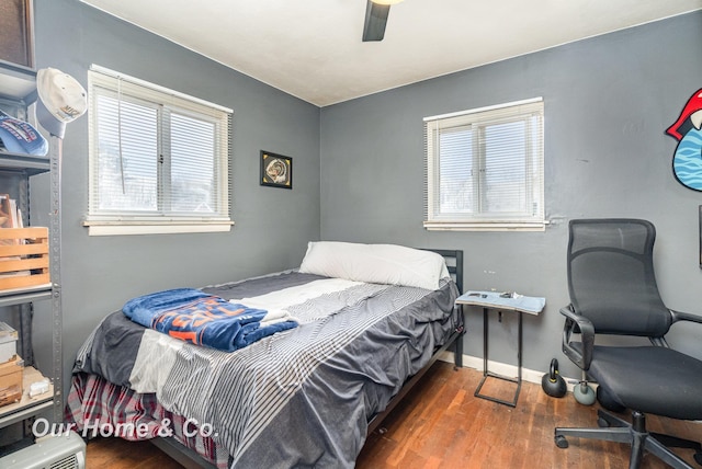 bedroom featuring dark hardwood / wood-style floors and ceiling fan