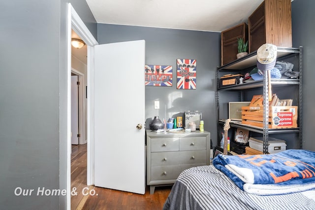 bedroom featuring dark hardwood / wood-style flooring