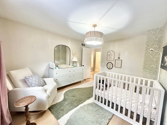 bedroom featuring light wood-type flooring