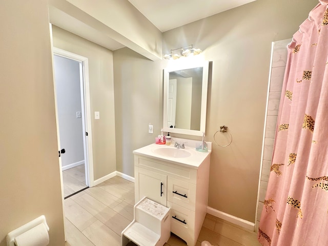 bathroom featuring vanity and a shower with shower curtain