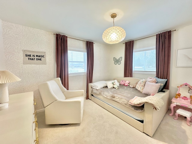 carpeted bedroom featuring multiple windows