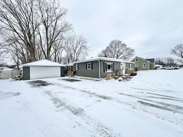 view of front of property featuring an outbuilding and a garage